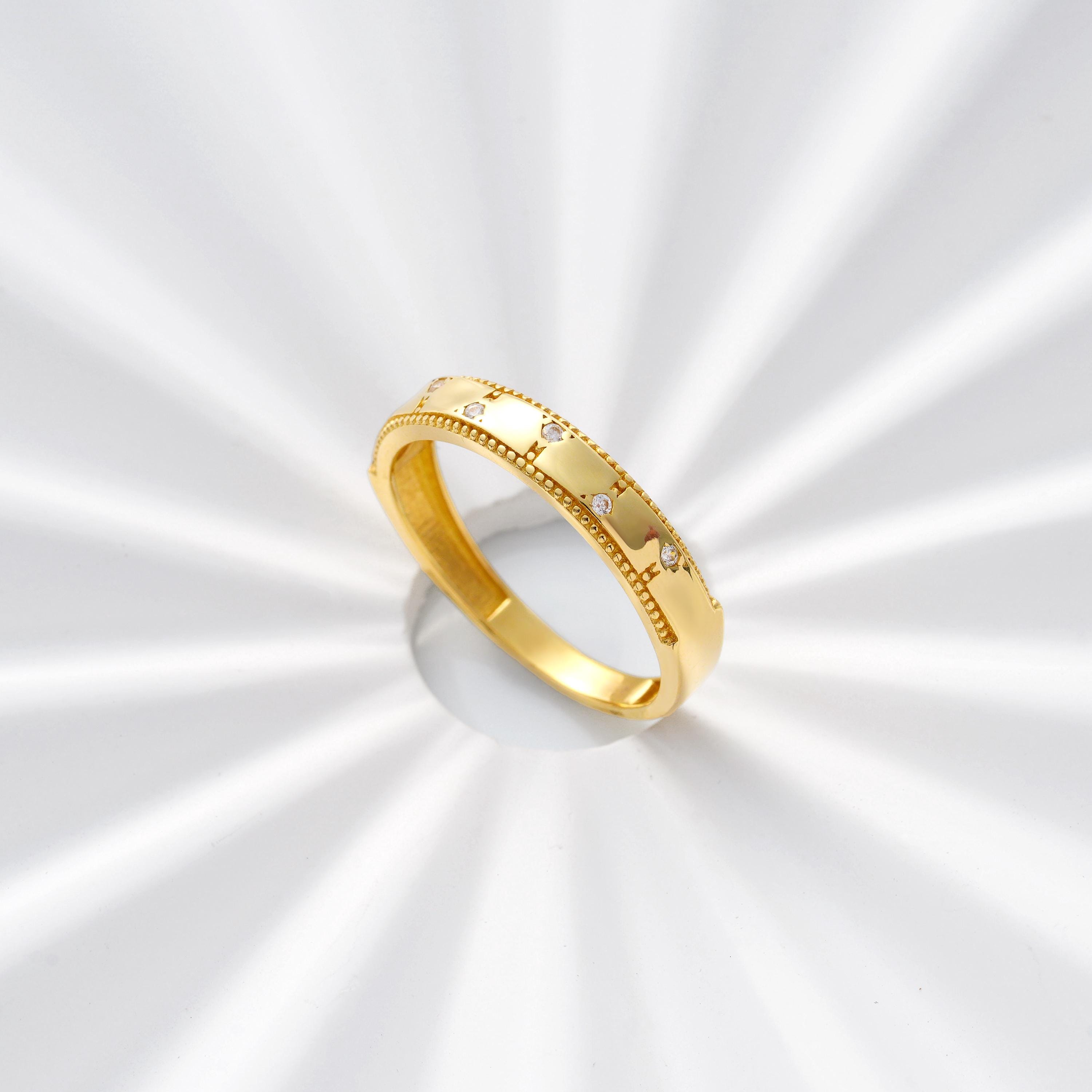 scattered CZ diamond solid gold wedding ring with polished finish and milgrain edges