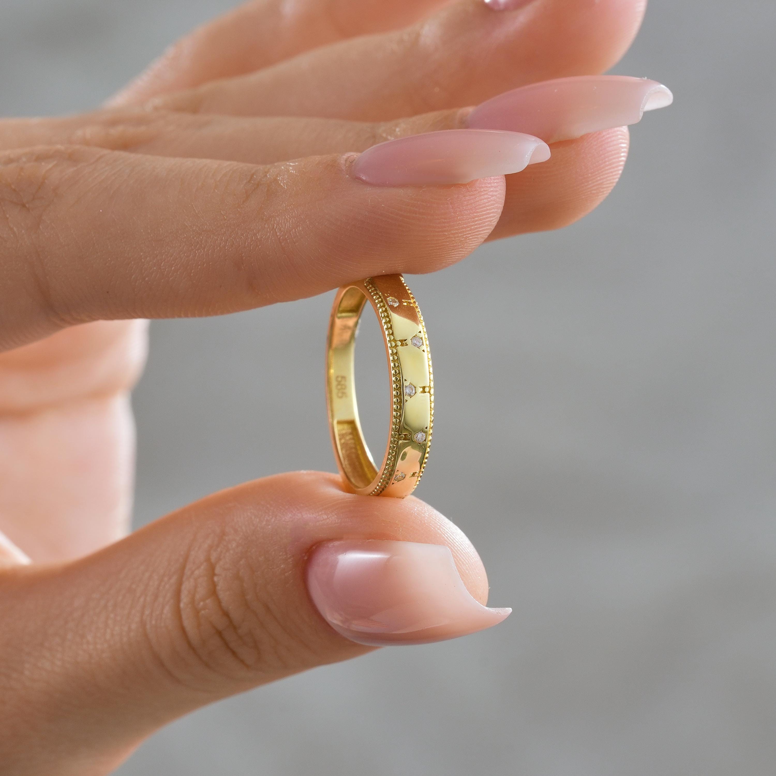 solid gold scattered CZ round diamonds wedding band