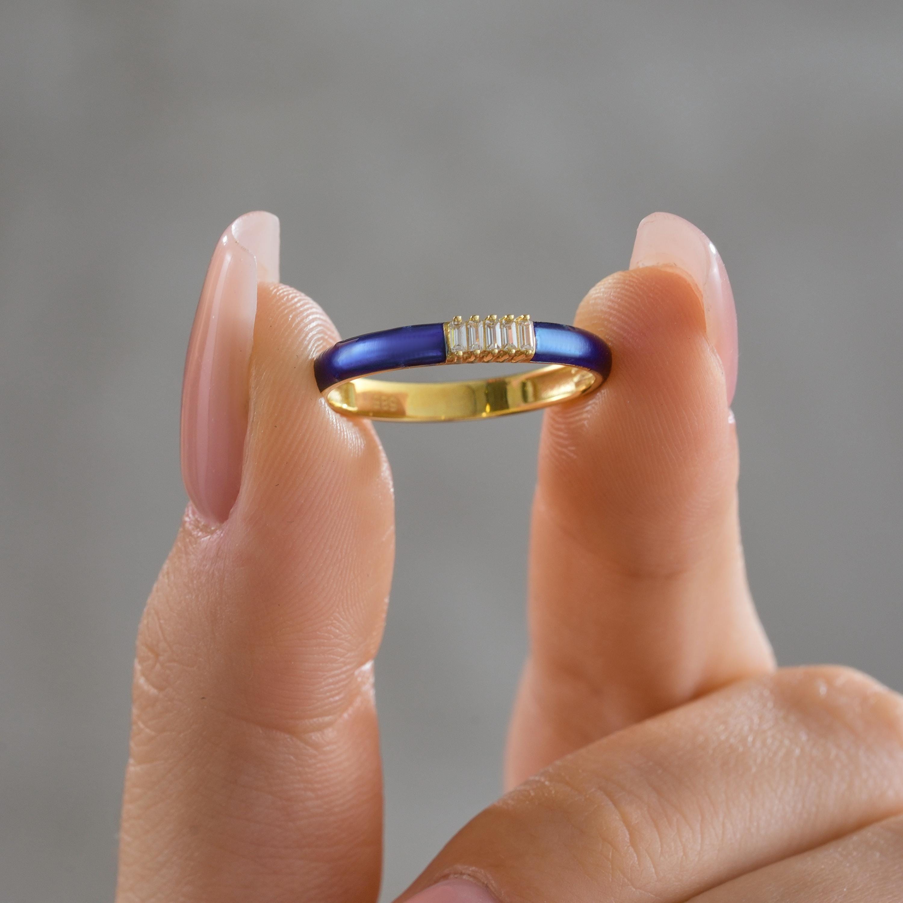 gold deep navy blue enamel band and vertical baguette CZ diamond bar