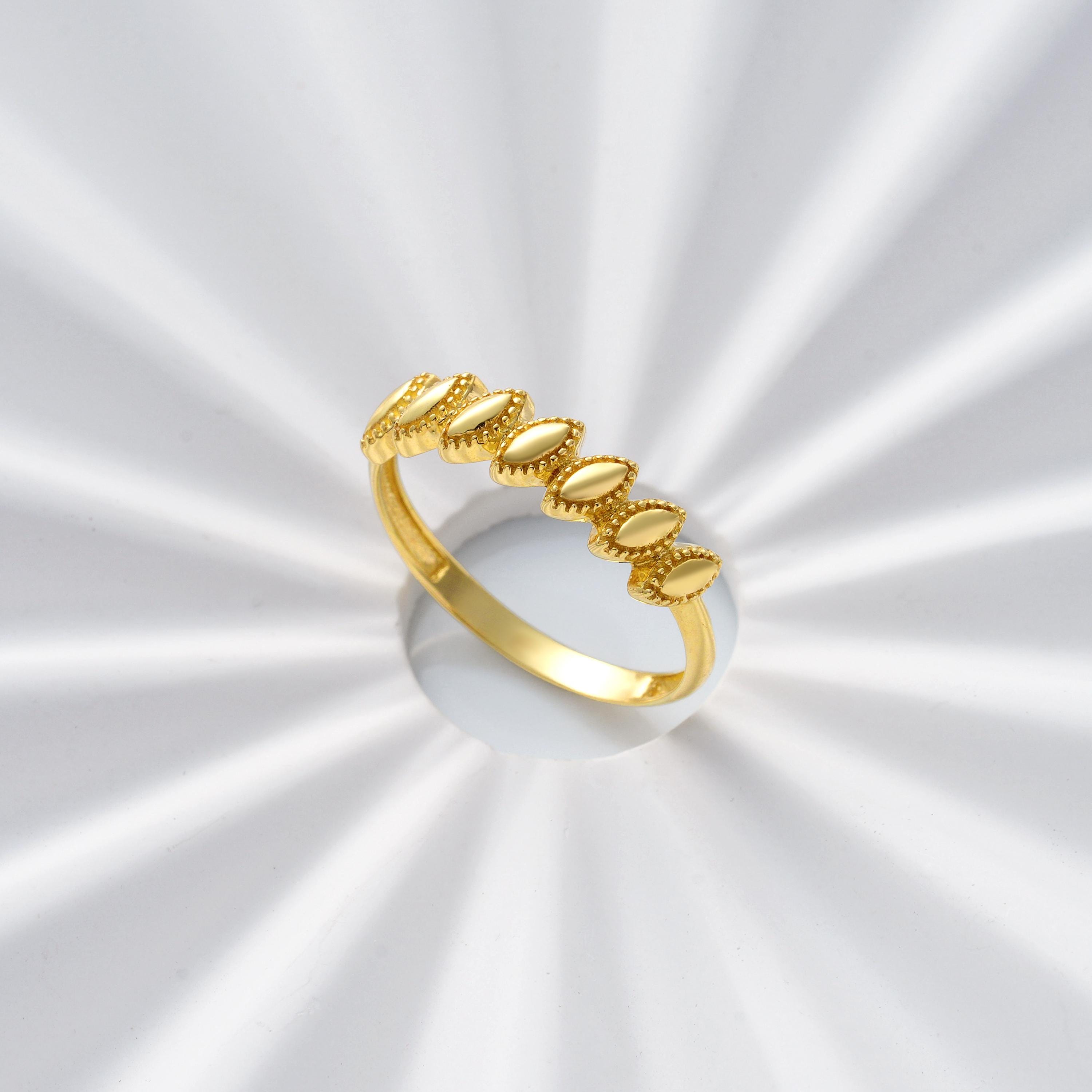 solid gold marquise station ring with milgrain detailing showing smooth plain band back dainty stackable jewelry