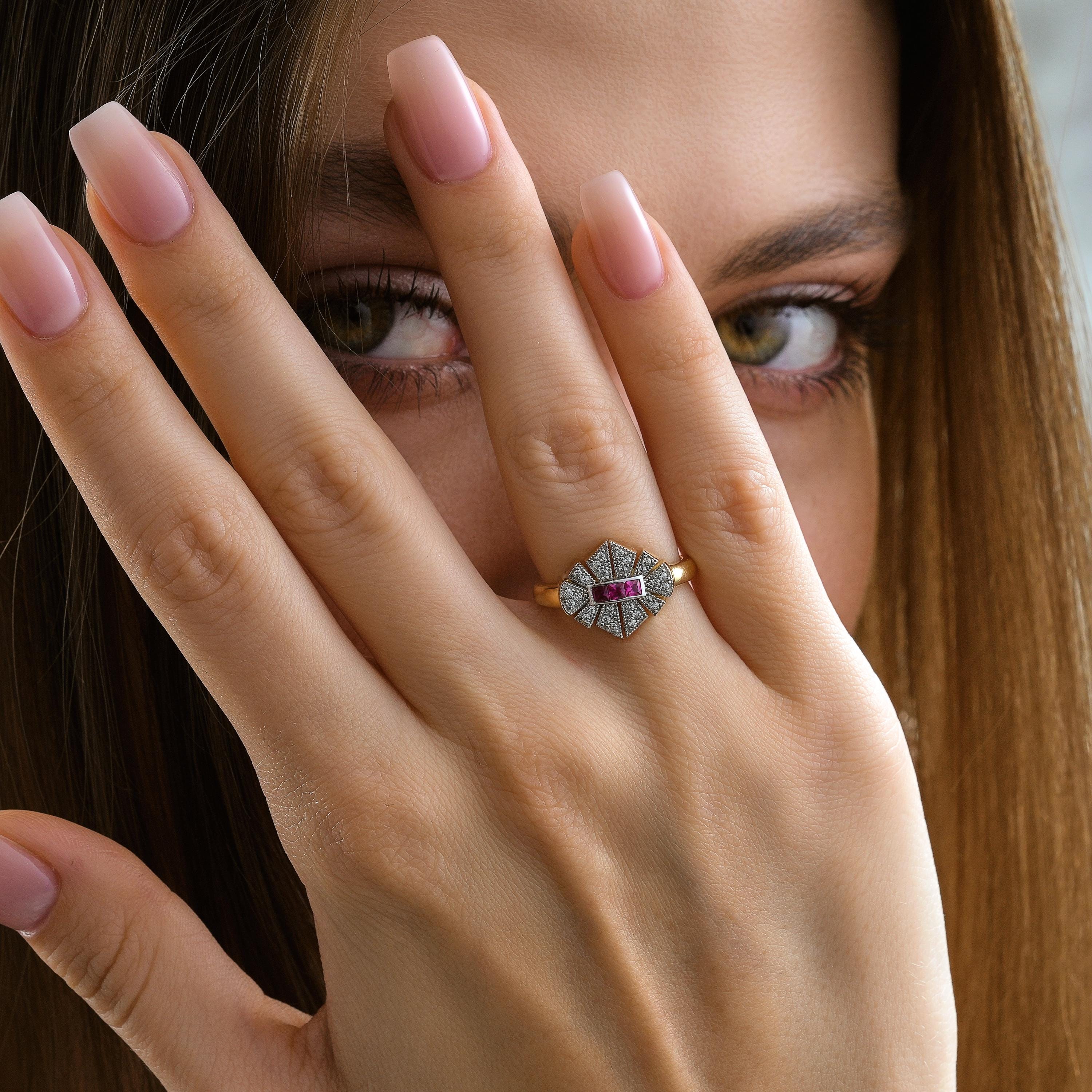 yellow gold ruby colored princess cut cluster ring