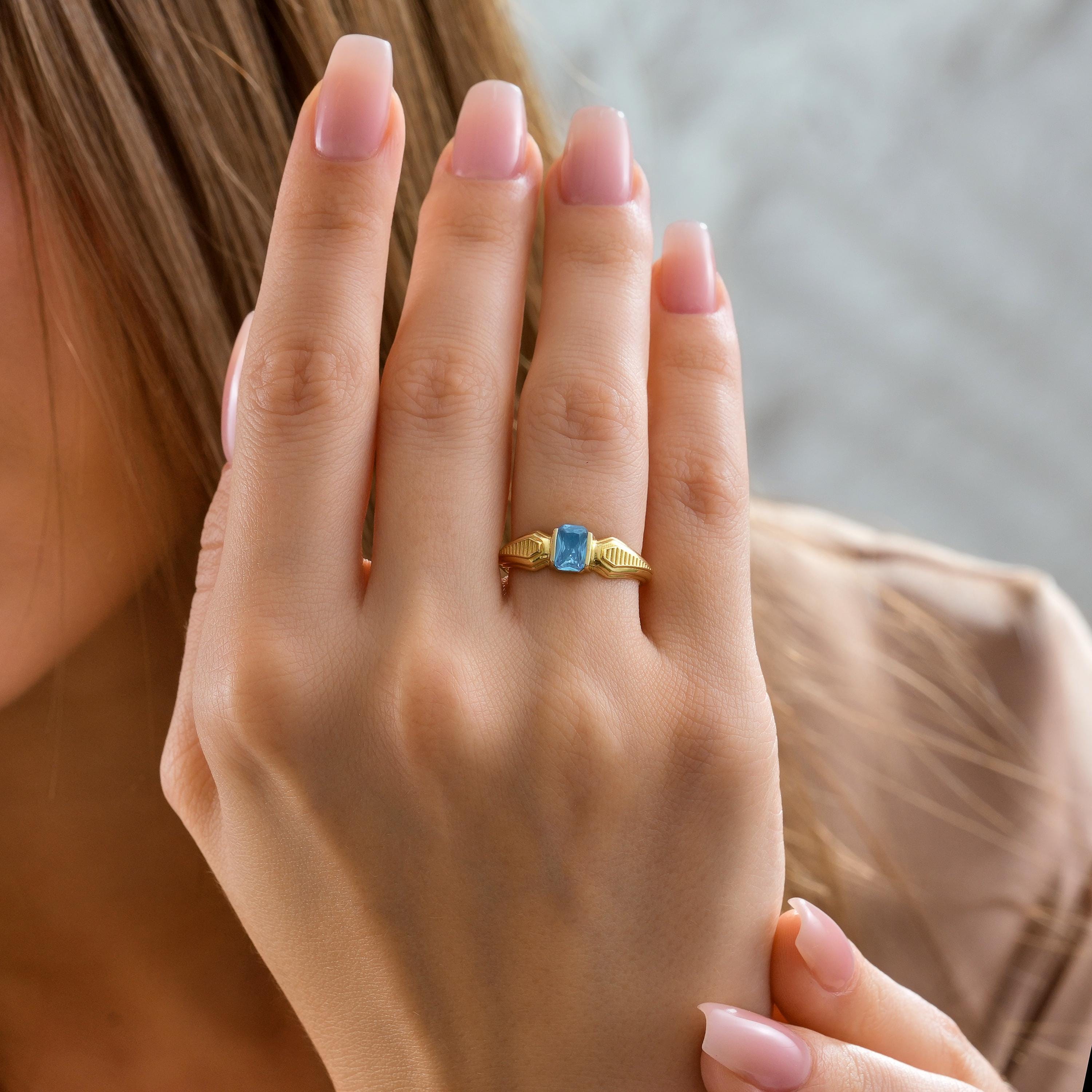 Solid Gold Emerald Cut Blue Topaz Birthstone Ring