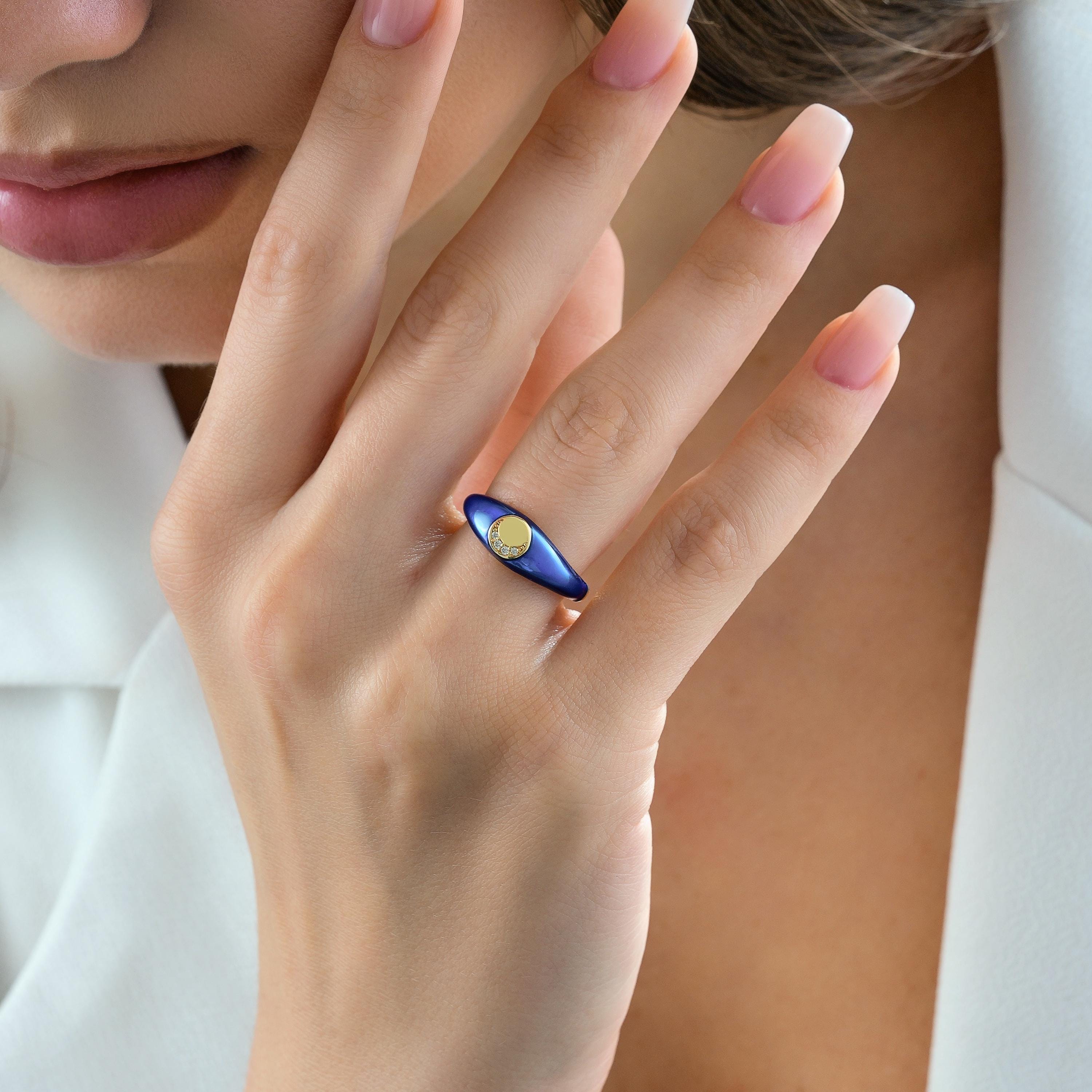 gold blue enamel signet ring with crescent-shaped CZ diamond accent