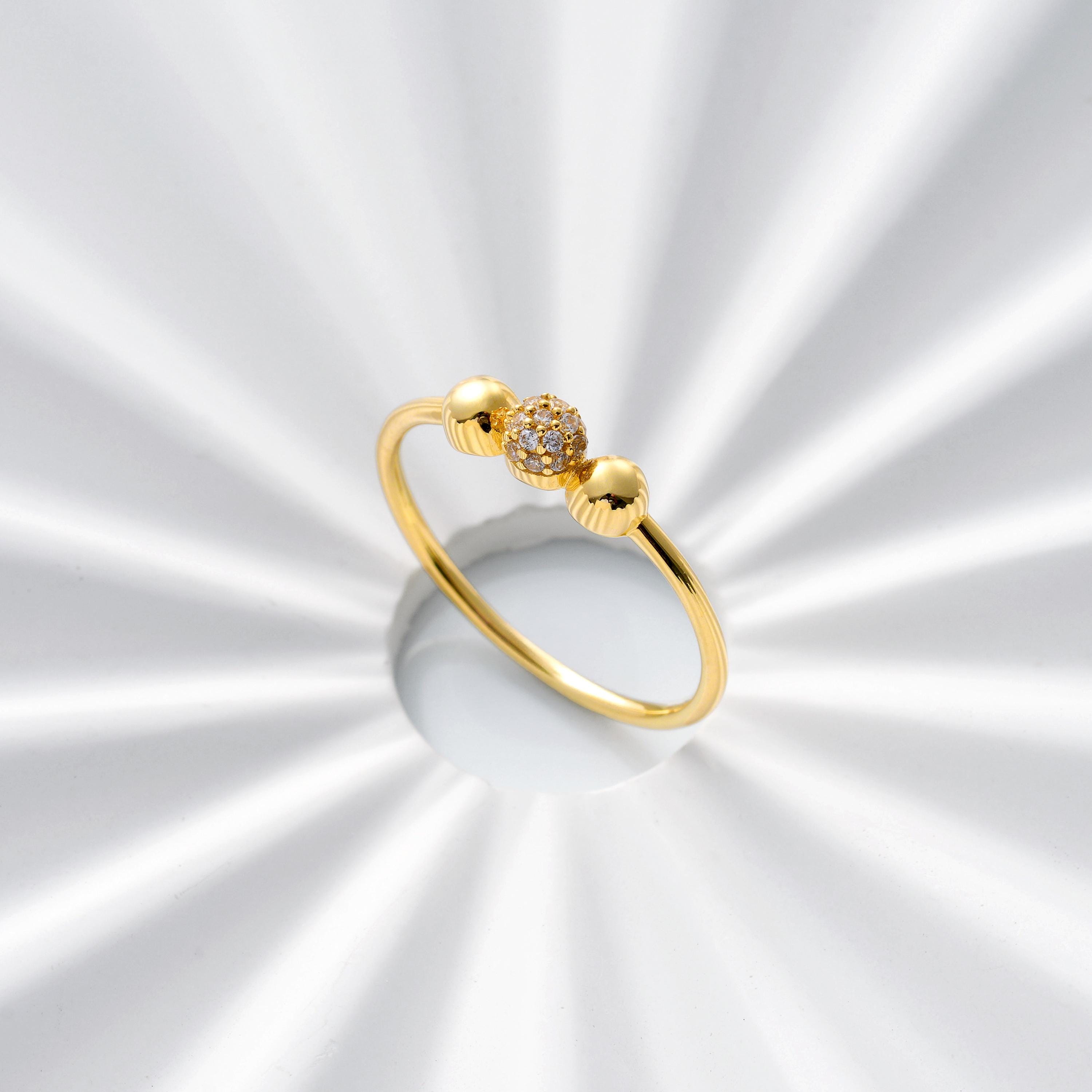 Delicate solid gold ball ring with pave diamond center sphere