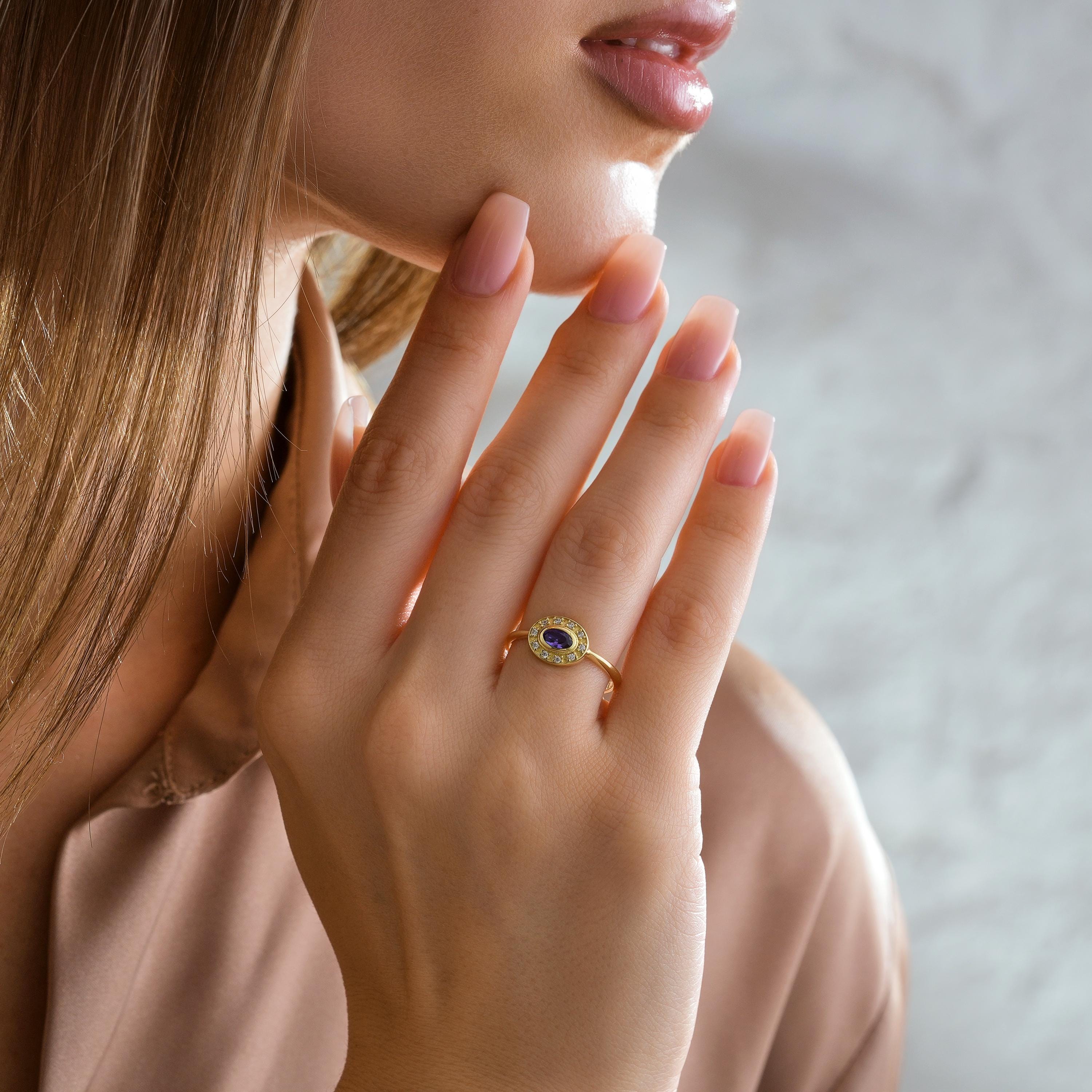 solid gold bezel oval gemstone diamond halo ring